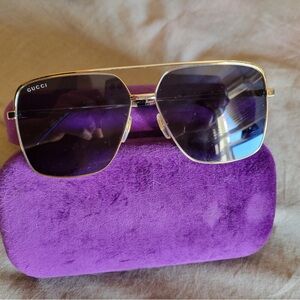 Gucci Women's Sunglasses with Gold Frame and Dark Lenses